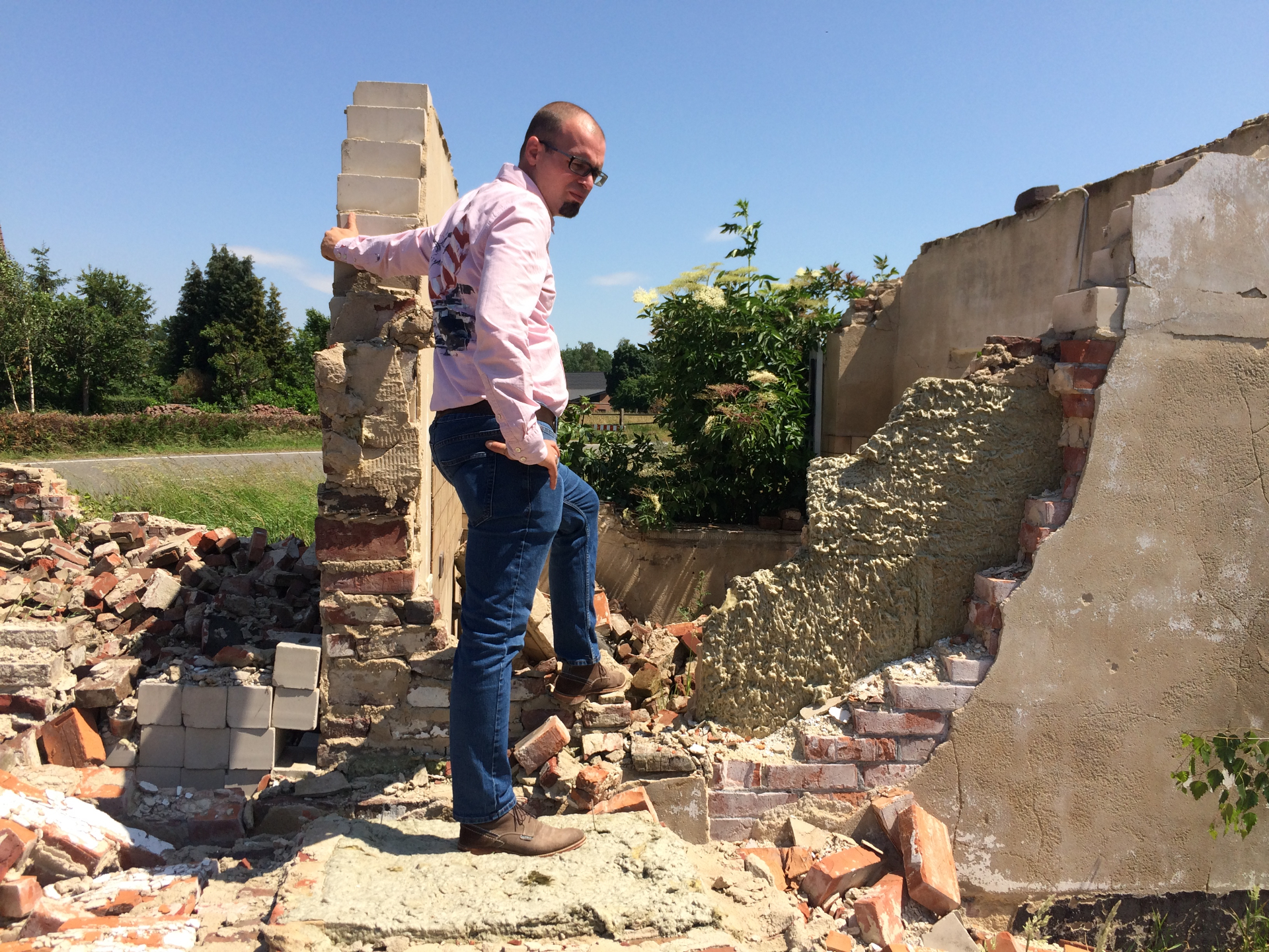 Robin amid rubble and partially collapsed walls