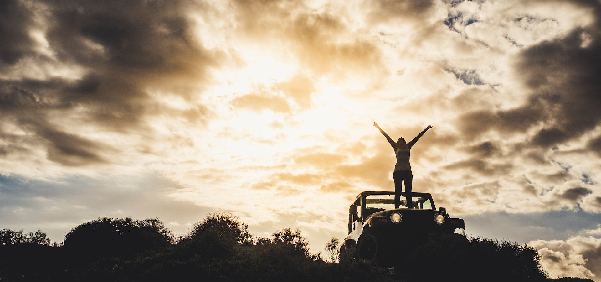 A traveller on a mountain top, a symbol of hope and destination